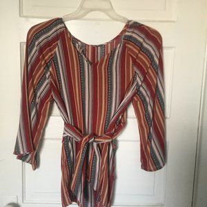 Burgundy multi-colored blouse with tie front.